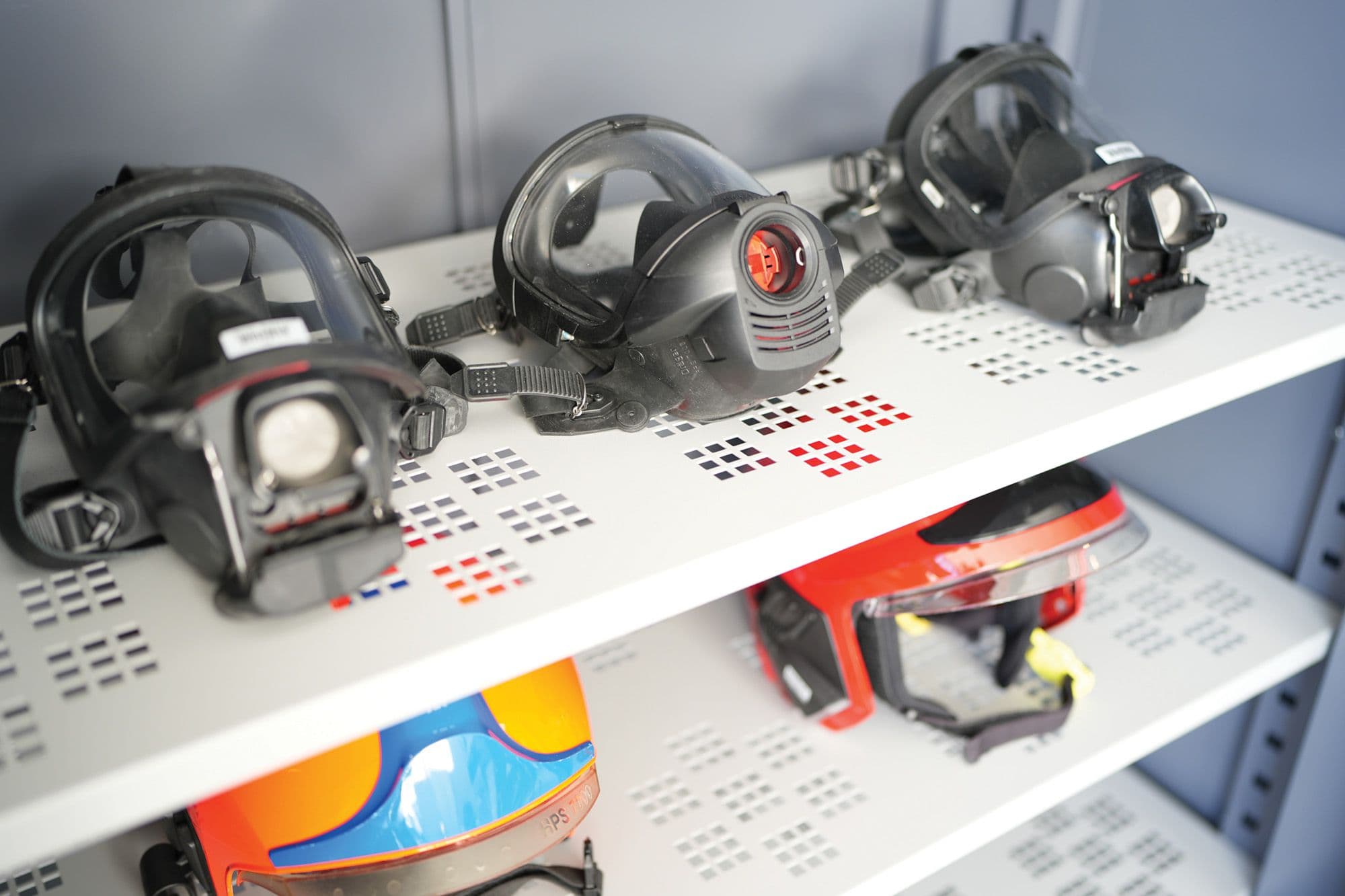 PPE drying cabinet with firefighter protective equipment